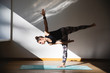 © Michela Ravasio/Stocksy - Woman doing balance yoga position