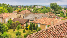Summer City Landscape - View Of The Roofs Of Houses In A Provincial French Town, In The Historical Province Gascony, The Region Of Occitanie Of Southwestern France