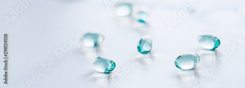 Fotomural Blue pills for healthy diet nutrition, supplements pill and probiotics capsules,
