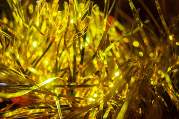 Yellow tinsel close-up. Christmas decor