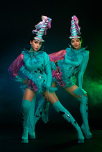 Two Beautiful Go-go Dancer Girls In Freak Costumes On Disco Party In Color Smoke. Night Show Women.