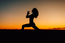 Silhouettes Of People Training Yoga