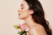 © leandro crespi/Stocksy - Woman portrait with Flowers