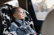 © Kelly Knox/Stocksy - toddler riding in a car