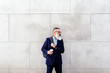 © Santi Nunez/Stocksy - Portrait of handsome senior businessman