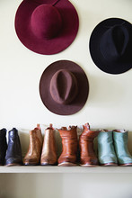 Boots And Hats Arranged On A Shelf