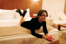 Portrait Of Young Androgyne Woman On The Bed