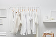 © 365mm/Stocksy - Interior of white cloakroom with rack