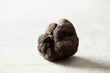 © 365mm/Stocksy - Closeup of rough black truffle