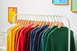 © 365mm/Stocksy - Collection of multicolored clothing on rack