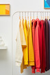 © 365mm/Stocksy - Vibrant clothing hanging on rack