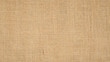 Hessian sackcloth burlap woven texture background  / cotton woven fabric background with flecks of varying colors of beige and brown. with copy space. office desk concept.High Resolution horizontal  