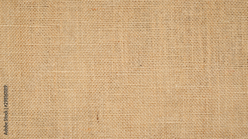 Fotomural Hessian sackcloth burlap woven texture background / cotton woven fabric background with flecks of varying colors of beige and brown
