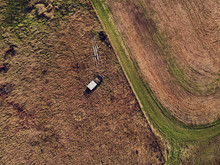 Old Abandoned And Rusty Vehicles In The Autumn Field From Above