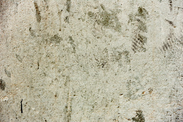 Texture of a concrete wall with cracks and scratches which can be used as a background