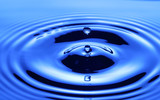 Fototapeta Niebo - Splash of drop water in blue tone, blank spce from above to create concepttual.