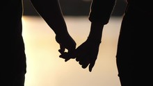 Silhouette Lovers Hold Hands Together Love Each Other Forever During The Sunset Golden Light, Romantic Concept.