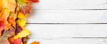 Autumn Leaves On White Wooden Table With Copyspace. Flat Lay. Banner