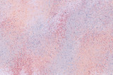 Fototapeta Tęcza - A background of a mixture of grainy orange, blue, lilac, crimson, pink sand on white background