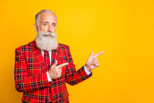 Photo Of Cool Grandpa Guy Indicating Fingers Empty Space Salesman Wear Unusual Lumberjack Holiday Suit Red Blazer Tie Outfit Isolated Yellow Color Background