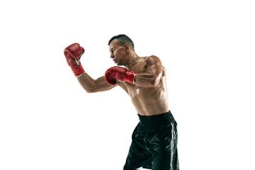 Full length portrait of muscular sportsman with prosthetic leg, copy space. Male boxer in red gloves training and practicing. Isolated on white studio background. Concept of sport, healthy lifestyle.