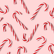 Flat Lay Composition With Candy Canes On Pink Background.
