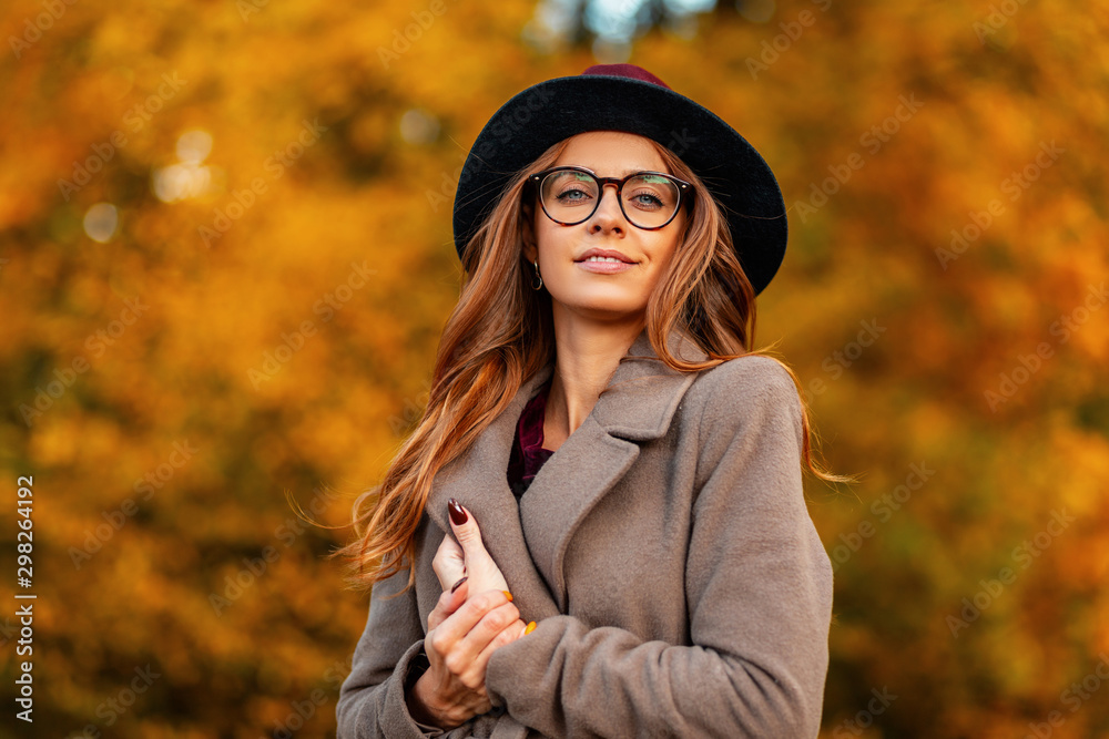 Portrait of attractive elegant young woman in stylish glasses in a ...