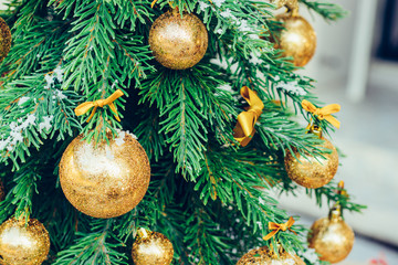 Wall Mural - Green fir tree with golden balls. Christmas wallpaper.