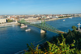 Fototapeta Niebo - Budapest, Hungary - October 01, 2019: View of the Liberty bridge and the river Danube with Gellért Hill (Hungarian: Gellért-hegy).