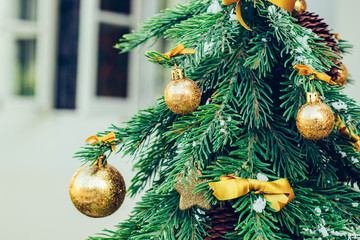 Wall Mural - Green fir tree with golden balls. Christmas wallpaper.
