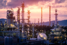 Gas Refinery Plant On Sunset Sky Background, Manufacturing Of Petrochemical Industrial Plant With Distillation Tower And Gas Storage Sphere Tank