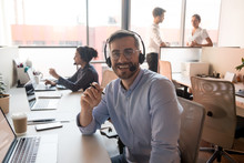 Millennial Happy Male Call Center Agent Looking Into Camera.