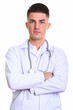 © Ranta Images - Close up of young handsome man doctor with arms crossed