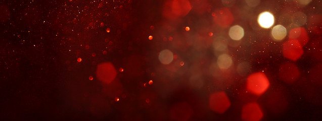Wall Mural - background of abstract red, gold and black glitter lights. defocused. banner