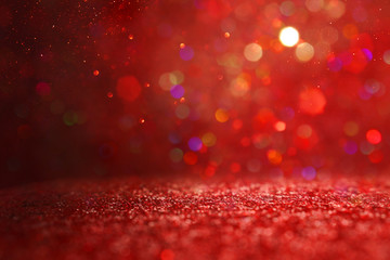 background of abstract red, gold and black glitter lights. defocused