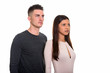 © Ranta Images - Studio shot of young couple looking at the distance together