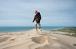 © Jan & Nadine Boerner/Westend61 - Denmark, Jutland, Rubjerg Knude, running boy on giant sand dune
