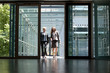 © Julia Otto und Florian Kuttler/Westend61 - Two businesswomen talking in office building