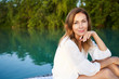 © PHILIPP NEMENZ/Westend61 - Portrait of mature woman at a lake
