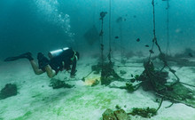 Diver Checking Out Abounded Lobster Cages In Phuket