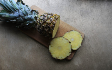 Wall Mural - Pineapple on a wooden board