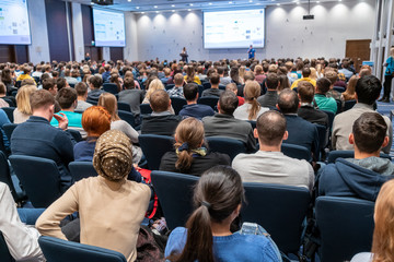 image of a conference that takes place in a large conference room, workshop for young professionals,