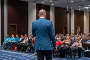 image of a conference that takes place in a large conference room, workshop for young professionals,