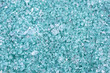 Fragments of blue glass. Small and sharp fragments of broken glass. cullet for creation of new glass are ready to be remelted. lot of particles of shattered glass. Garbage recycling. Ecology, trash