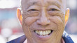 Portrait of retired senior Asian male with a big smile looking to camera 