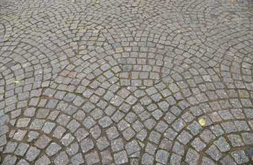 Old cobblestone pavement close-up.