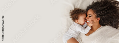 Cuadros en Lienzo Love of a mother and baby. Family at home. Lifestyle