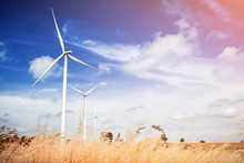 Wind Turbine Is Alternative Electrical Power With Blue Sky, Summer Field, Renewable Energy