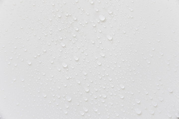 Fototapete - Raindrops on a grayish white background. Rainy season concept.