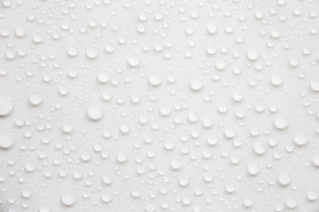 Poster - Raindrops on a grayish white background. Rainy season concept.